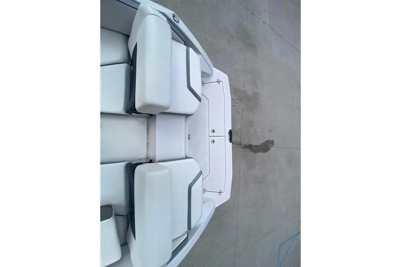 Slide: The Image of 2018 Scarab 215 G boat interior with white cushioned seating. - 9