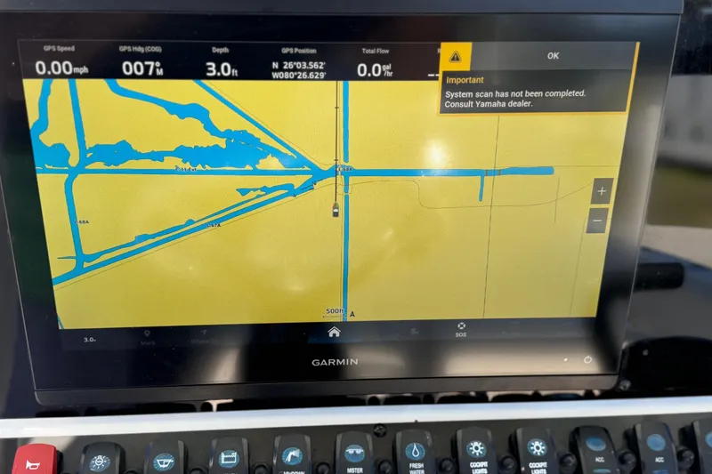 Slide: The Image of Garmin marine GPS display on 2021 Sea Hunt Ultra 234, showing navigation map and system alert. - 19