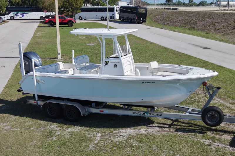 Slide: The Image of 2021 Sea Hunt Ultra 234 boat on trailer, parked outdoors. - 5
