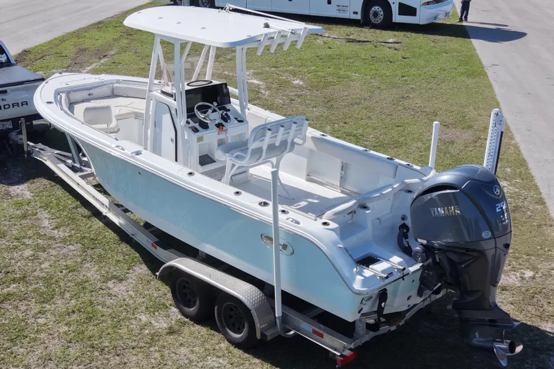 Slide: The Image of 2021 Sea Hunt Ultra 234 boat on trailer with Yamaha outboard motor. - 9