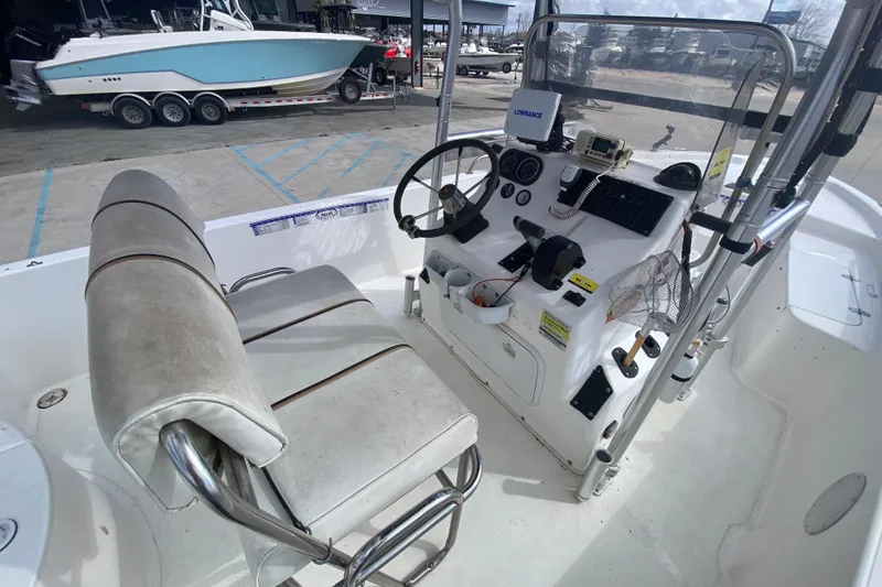 Slide: The Image of 2002 Century 2101 Bay Boat cockpit with steering wheel and navigation equipment. - 18