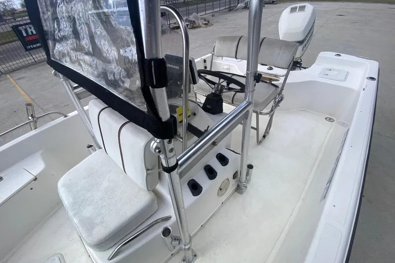 Slide: The Image of 2002 Century 2101 Bay Boat interior with steering console and seating. - 5