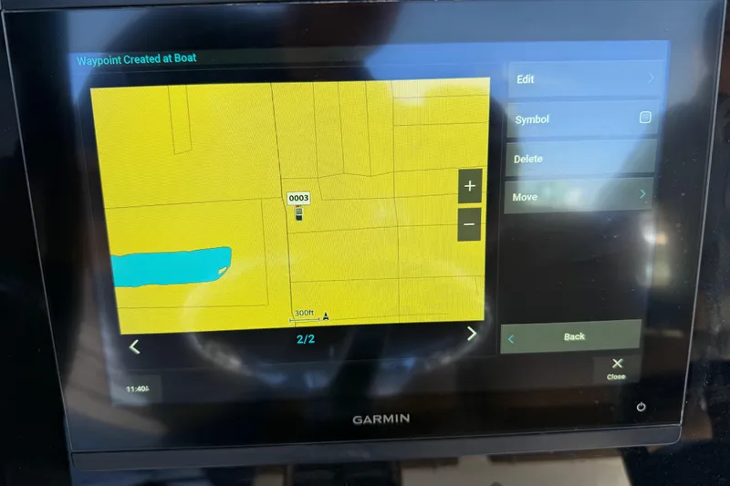 Slide: The Image of Garmin navigation screen on 2022 Sea Hunt Ultra 265 SE boat, displaying waypoint map. - 16