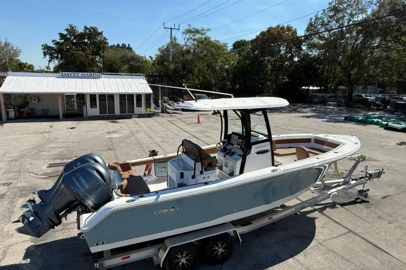 Slide: The Image of 2022 Sea Hunt Ultra 265 SE boat on trailer at Davey Marine dealership. - 6