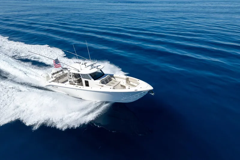 Slide: The Image of 2024 Solace 41 CS boat cruising on open blue ocean waters. - 15