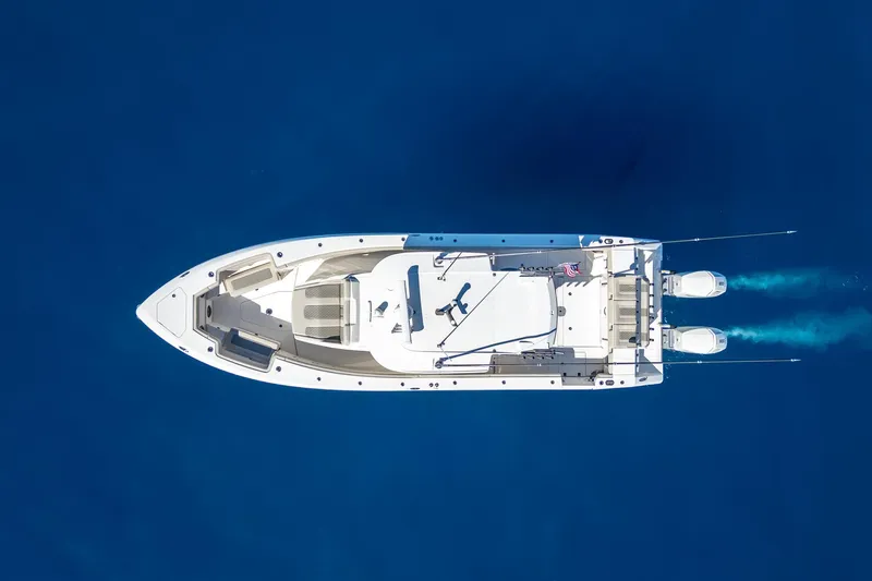 Slide: The Image of Aerial view of 2024 Solace 41 CS boat cruising on deep blue water. - 17