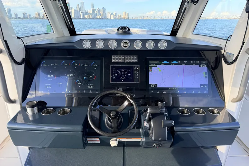 Slide: The Image of 2024 Solace 41 CS helm with advanced navigation displays and city skyline view. - 22