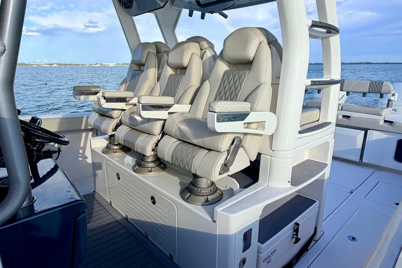 Slide: The Image of Luxurious seating on 2024 Solace 41 CS boat, featuring ergonomic design and ocean backdrop. - 23