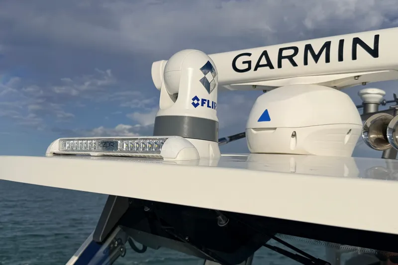 Slide: The Image of 2024 Solace 41 CS boat with Garmin and FLIR technology on deck. - 26