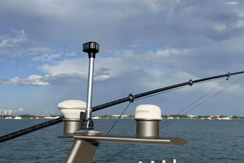 Slide: The Image of 2024 Solace 41 CS boat with Garmin equipment against a scenic ocean backdrop. - 27