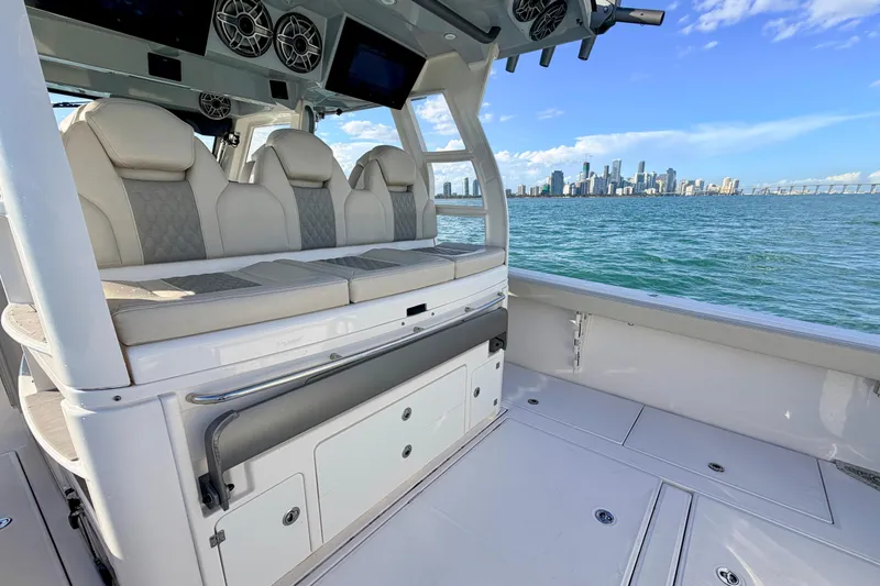 Slide: The Image of 2024 Solace 41 CS boat interior with city skyline view, featuring luxurious seating. - 28