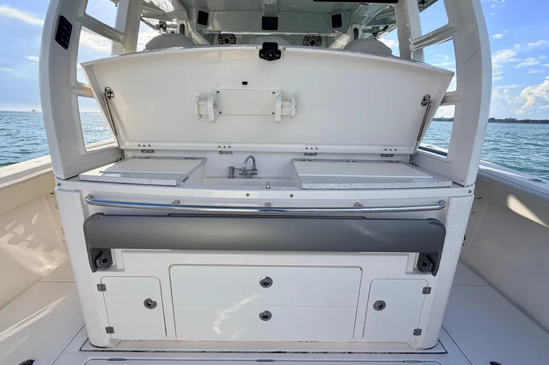 Slide: The Image of 2024 Solace 41 CS boat interior with sink and storage, ocean view. - 29