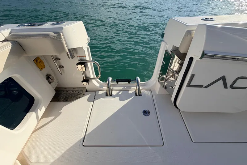 Slide: The Image of 2024 Solace 41 CS boat stern view with swim platform and ladder. - 36