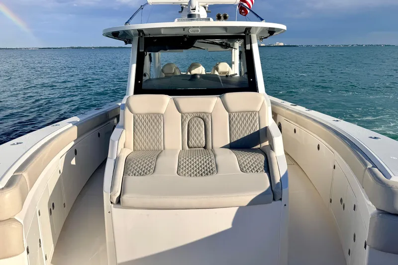 Slide: The Image of 2024 Solace 41 CS boat with luxurious seating, cruising on open water. - 37