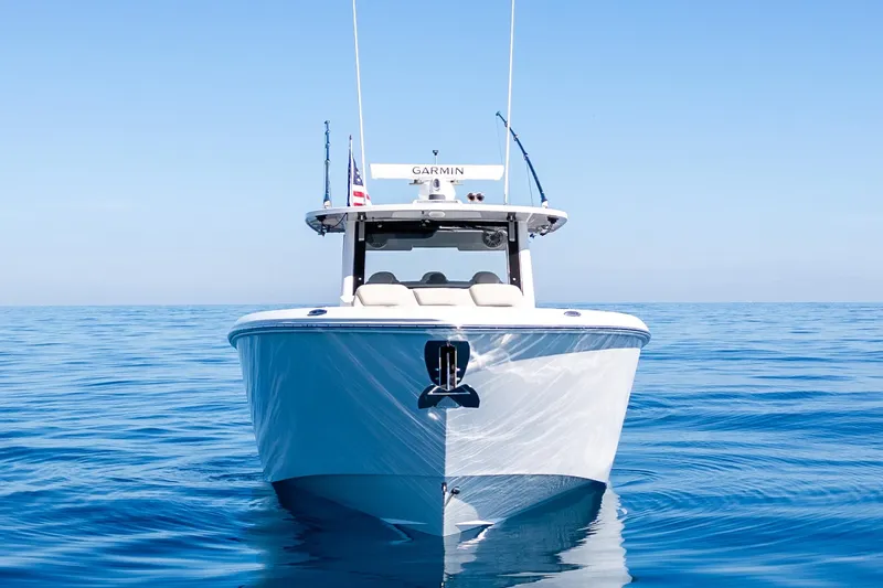 Slide: The Image of 2024 Solace 41 CS boat on calm blue ocean waters. - 4