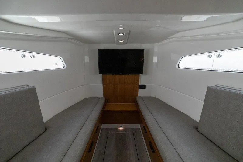 Slide: The Image of Manufacturer Provided Image: Interior cabin of 2024 Solace 41 CS boat with TV and seating. - 42