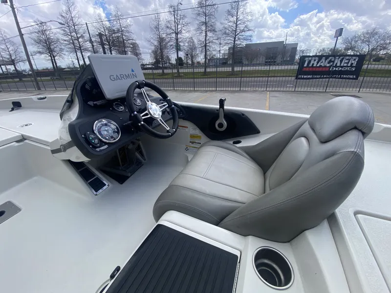 Slide: The Image of Interior of a 2013 Ranger Z518i Intercoastal boat with Garmin controls. - 11