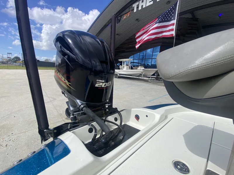 Slide: The Image of 2013 Ranger Z518i Intercoastal with Yamaha 200 engine, American flag in background. - 13