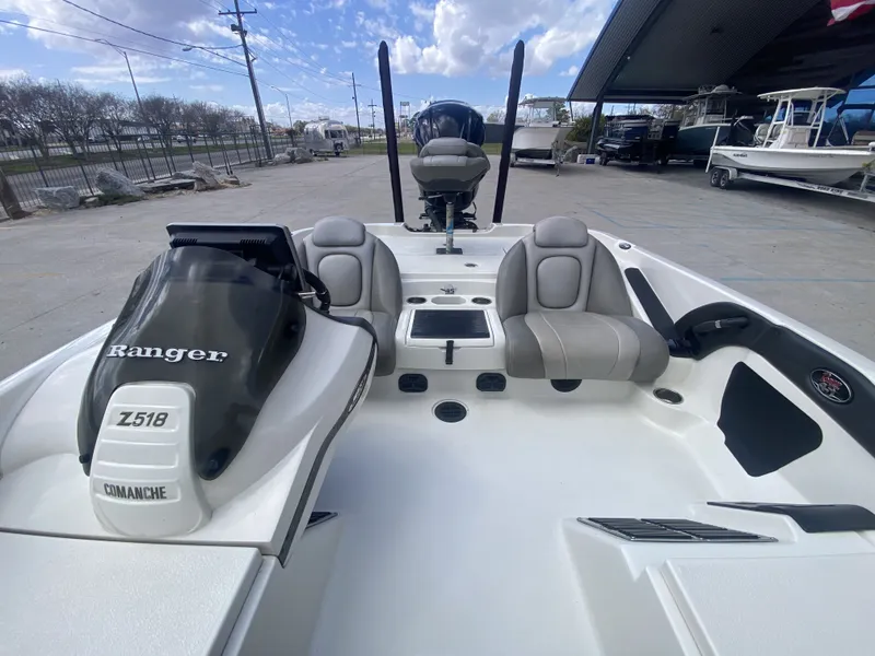 Slide: The Image of 2013 Ranger Z518i Intercoastal boat with gray seats outdoors. - 19