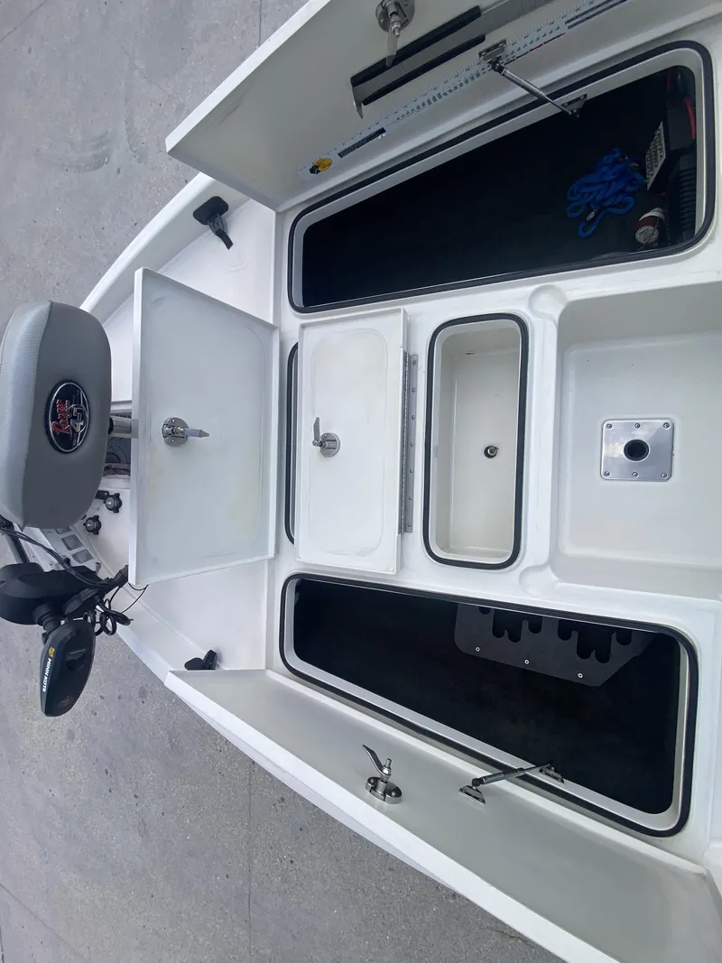 Slide: The Image of 2013 Ranger Z518i Intercoastal boat interior with storage compartments. - 8