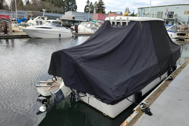 Slide: The Image of 2023 Boston Whaler 210 Montauk covered at marina dock. - 29