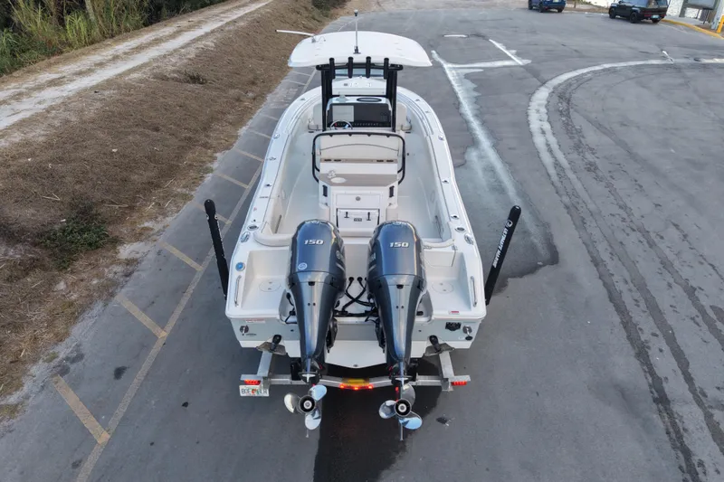 Slide: The Image of 2023 Sea Hunt Ultra 265 SE boat with dual engines on a trailer. - 10