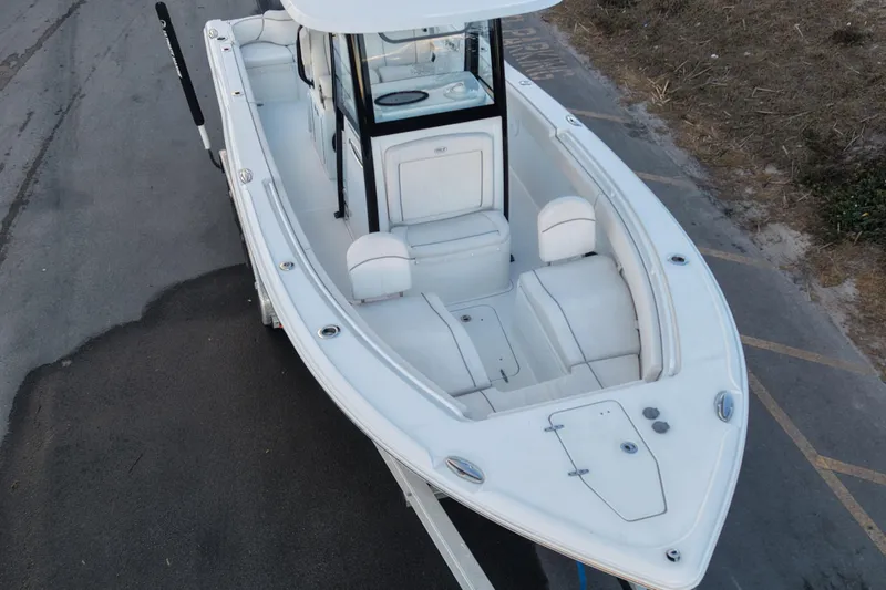 Slide: The Image of 2023 Sea Hunt Ultra 265 SE boat, aerial view, showcasing spacious seating and sleek design. - 11