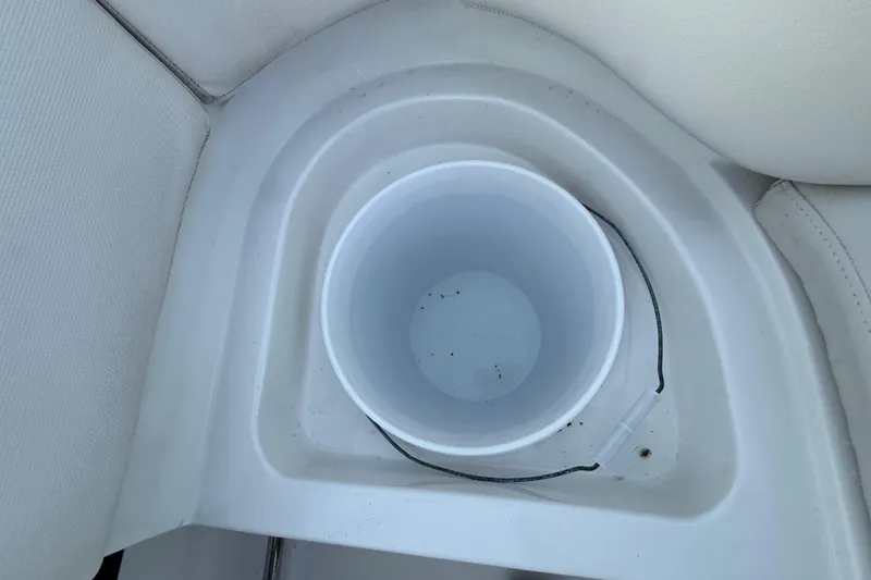 Slide: The Image of Cup holder on 2023 Sea Hunt Ultra 265 SE boat, featuring white interior. - 24