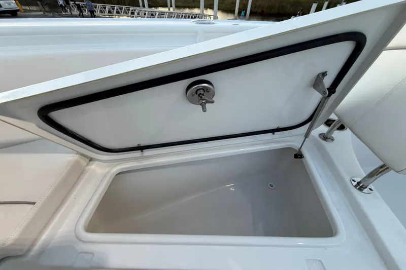 Slide: The Image of Open storage compartment on 2023 Sea Hunt Ultra 265 SE boat. - 30