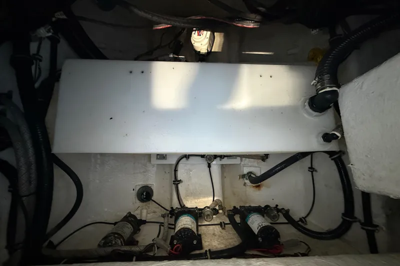 Slide: The Image of 2023 Sea Hunt Ultra 265 SE boat interior with visible wiring and components. - 35