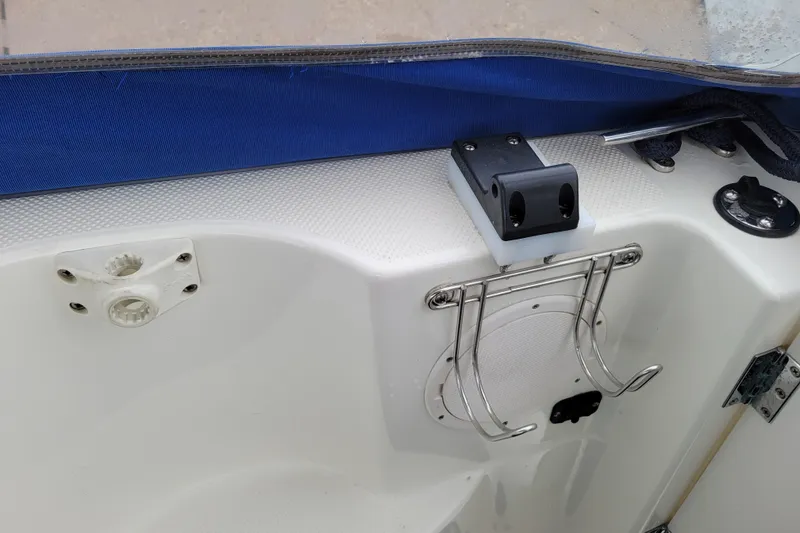 Slide: The Image of Open cabinet inside a 2004 Bayliner 285 boat, showing interior storage space. - 28