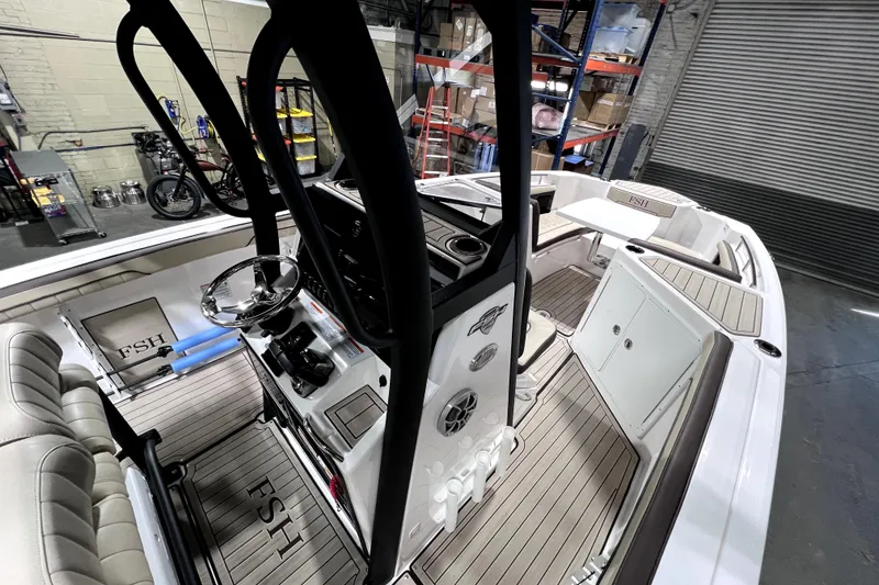 Slide: The Image of 2023 Yamaha Boats 255 FSH Sport E interior with sleek design and modern features. - 12