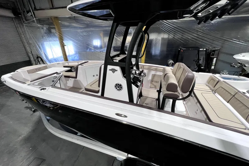 Slide: The Image of 2023 Yamaha Boats 255 FSH Sport E, sleek interior design, spacious seating, modern features. - 3