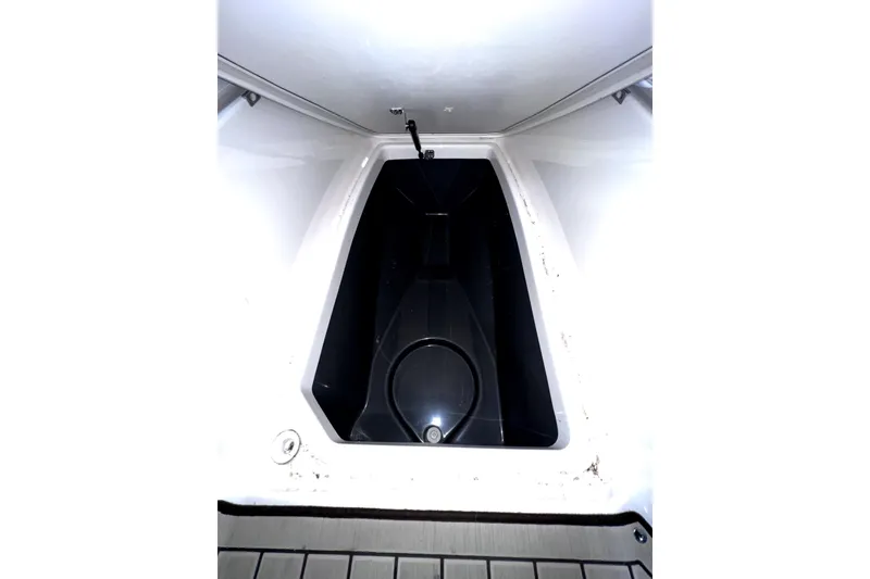 Slide: The Image of 2023 Yamaha Boats 255 FSH Sport E storage compartment, interior view. - 31