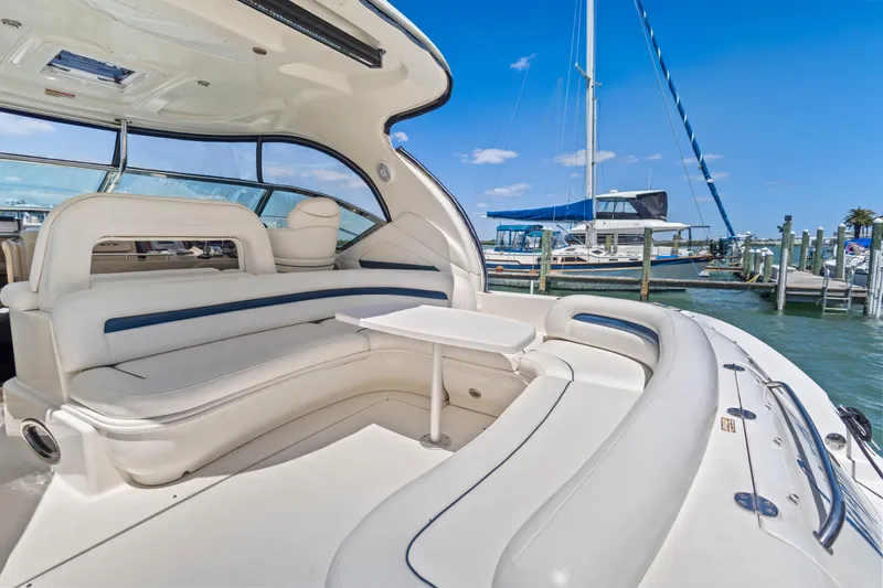 Slide: The Image of Luxurious 2004 Sea Ray 420 Sundancer yacht interior with plush seating and marina view. - 14