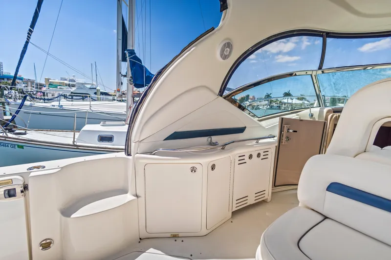 Slide: The Image of Interior view of a 2004 Sea Ray 420 Sundancer yacht at a marina. - 16