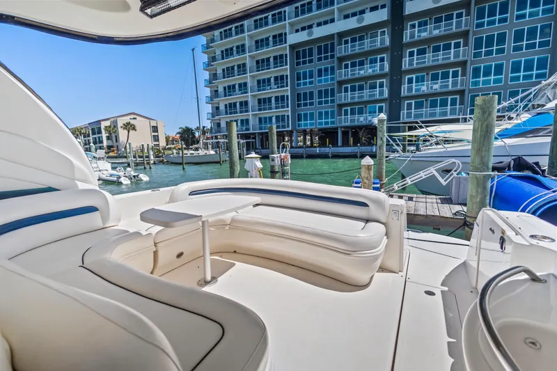 Slide: The Image of 2004 Sea Ray 420 Sundancer yacht interior with marina view and modern seating. - 17