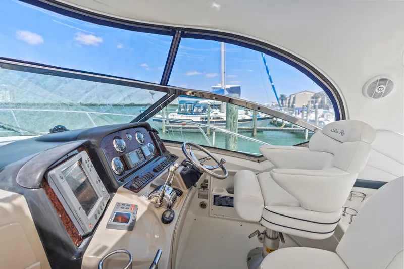 Slide: The Image of Interior view of 2004 Sea Ray 420 Sundancer yacht cockpit with helm and controls. - 20