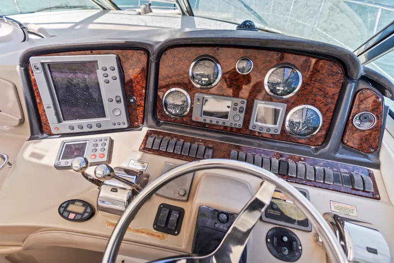 Slide: The Image of Dashboard of a 2004 Sea Ray 420 Sundancer boat with navigation instruments. - 27