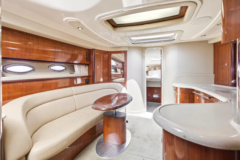 Slide: The Image of Luxurious interior of 2004 Sea Ray 420 Sundancer yacht with elegant wood finishes. - 30