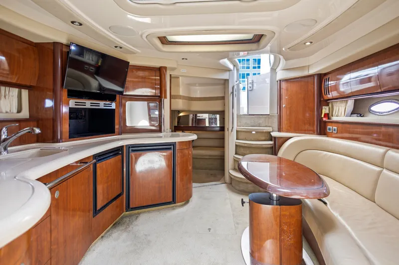 Slide: The Image of Luxurious interior of 2004 Sea Ray 420 Sundancer yacht with elegant wood finishes. - 34