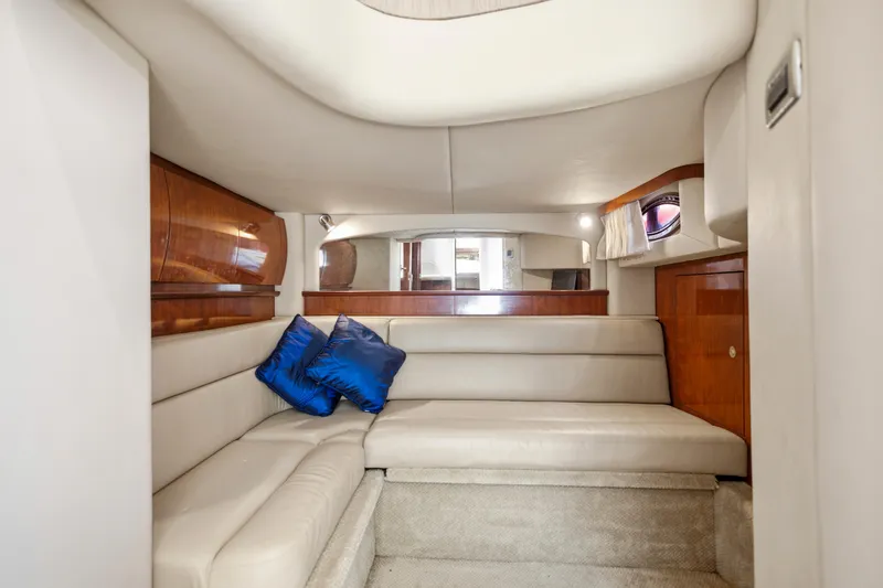 Slide: The Image of Luxurious interior of 2004 Sea Ray 420 Sundancer yacht with plush seating and blue cushions. - 35