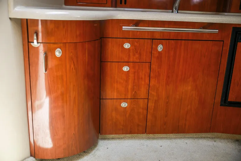 Slide: The Image of Wooden cabinetry in 2004 Sea Ray 420 Sundancer yacht interior, featuring sleek handles and modern design. - 39