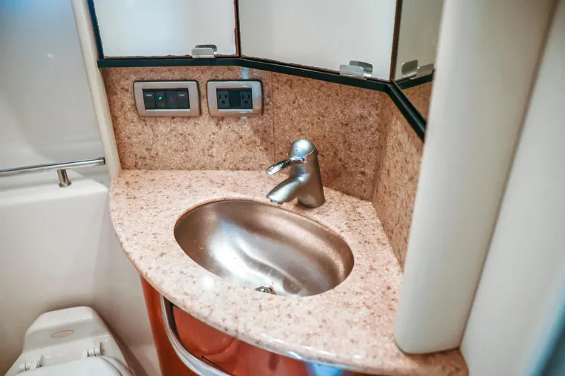 Slide: The Image of Bathroom sink area in 2004 Sea Ray 420 Sundancer yacht, featuring modern fixtures. - 41