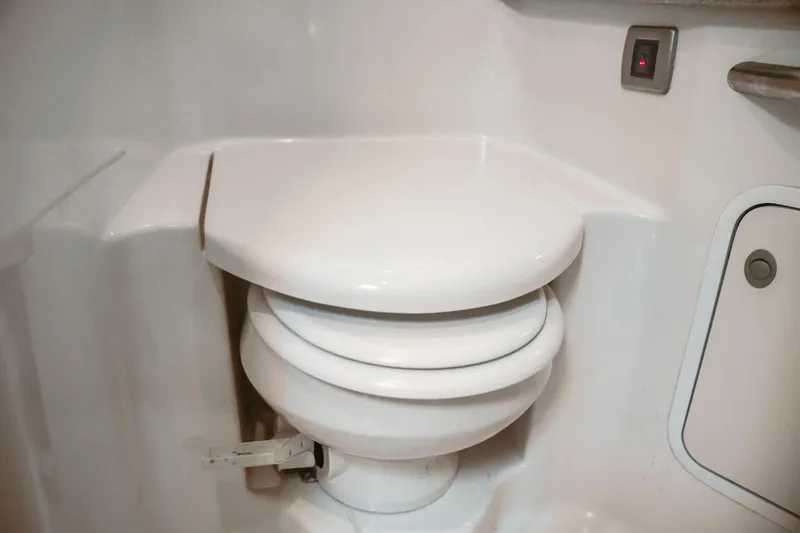 Slide: The Image of White marine toilet in 2004 Sea Ray 420 Sundancer yacht bathroom. - 47