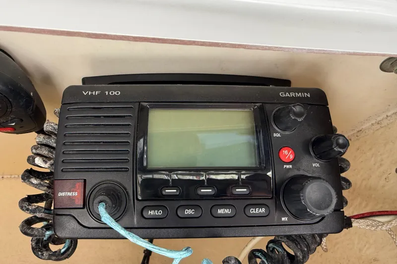 Slide: The Image of Garmin VHF 100 radio on 2017 Tidewater 220 CC Adventure boat dashboard. - 24