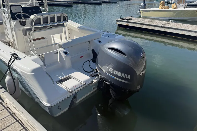 Slide: The Image of 2017 Tidewater 220 CC Adventure boat with Yamaha engine docked at marina. - 9