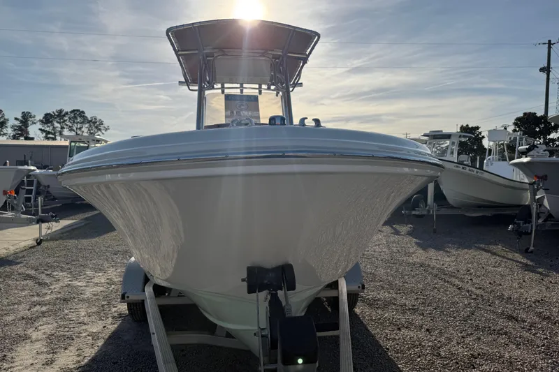 Slide: The Image of 2021 Pioneer 202 Islander boat on trailer, sunlit, in outdoor setting. - 17