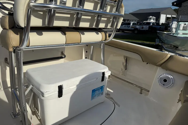 Slide: The Image of 2021 Pioneer 202 Islander boat interior with cooler and seating. - 33