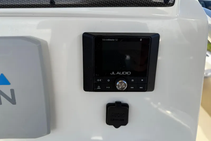 Slide: The Image of JL Audio system on 2021 Pioneer 202 Islander boat dashboard. - 35